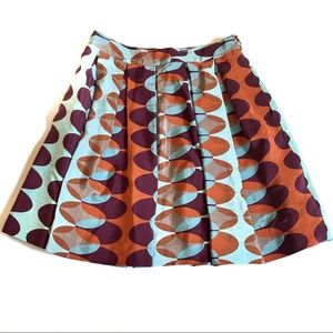 Anthropologie Retro Oval-Print Pleated Skirt in Aqua, Rust & Plum